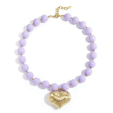 Bead necklace with hanging heart