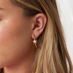 Creoles with embroidered star