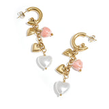 Earrings with dangling heart charms and pearls