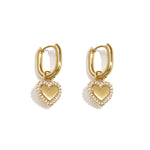 Squoval earrings with heart charms with set edges
