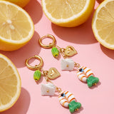 Earrings with chain and hanging charms
