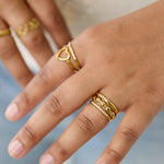 3-layer ring with round details and stones