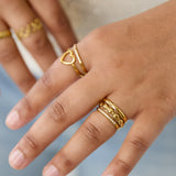 3-layer ring with round details and stones