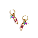 Earrings with dangling beads and a floral print