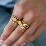 Layered statement ring with flower and stone