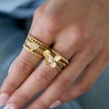 Layered statement ring with flower and stone