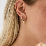Small hoop earrings with hanging flowers made of zirconia stones