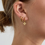 Small hoop earrings with zirconia-set clover charm