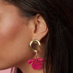 Round earrings with hanging flower