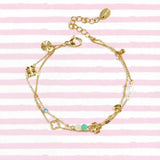 Bracelet with clover, beads and stones