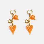 Earrings with dangling hearts on a chain