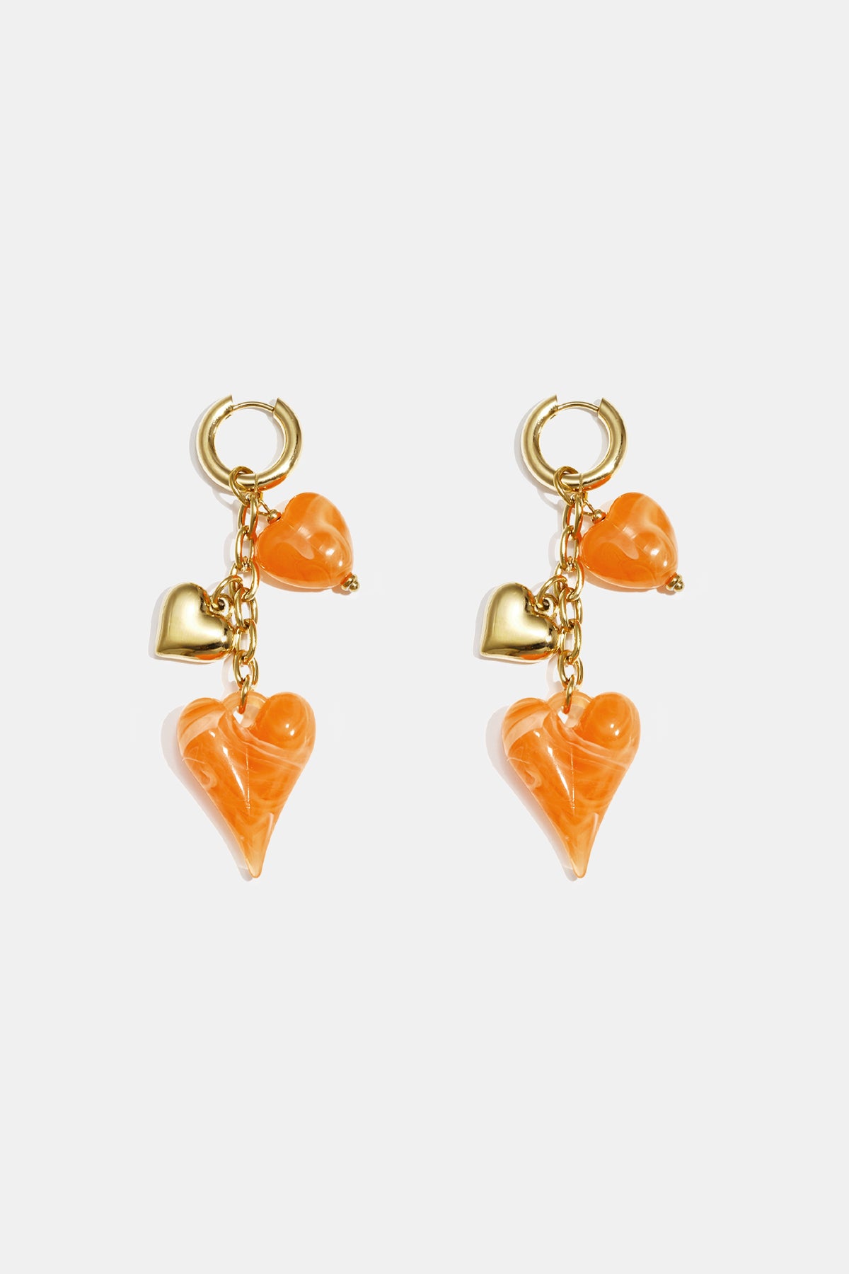 Earrings with dangling hearts on a chain