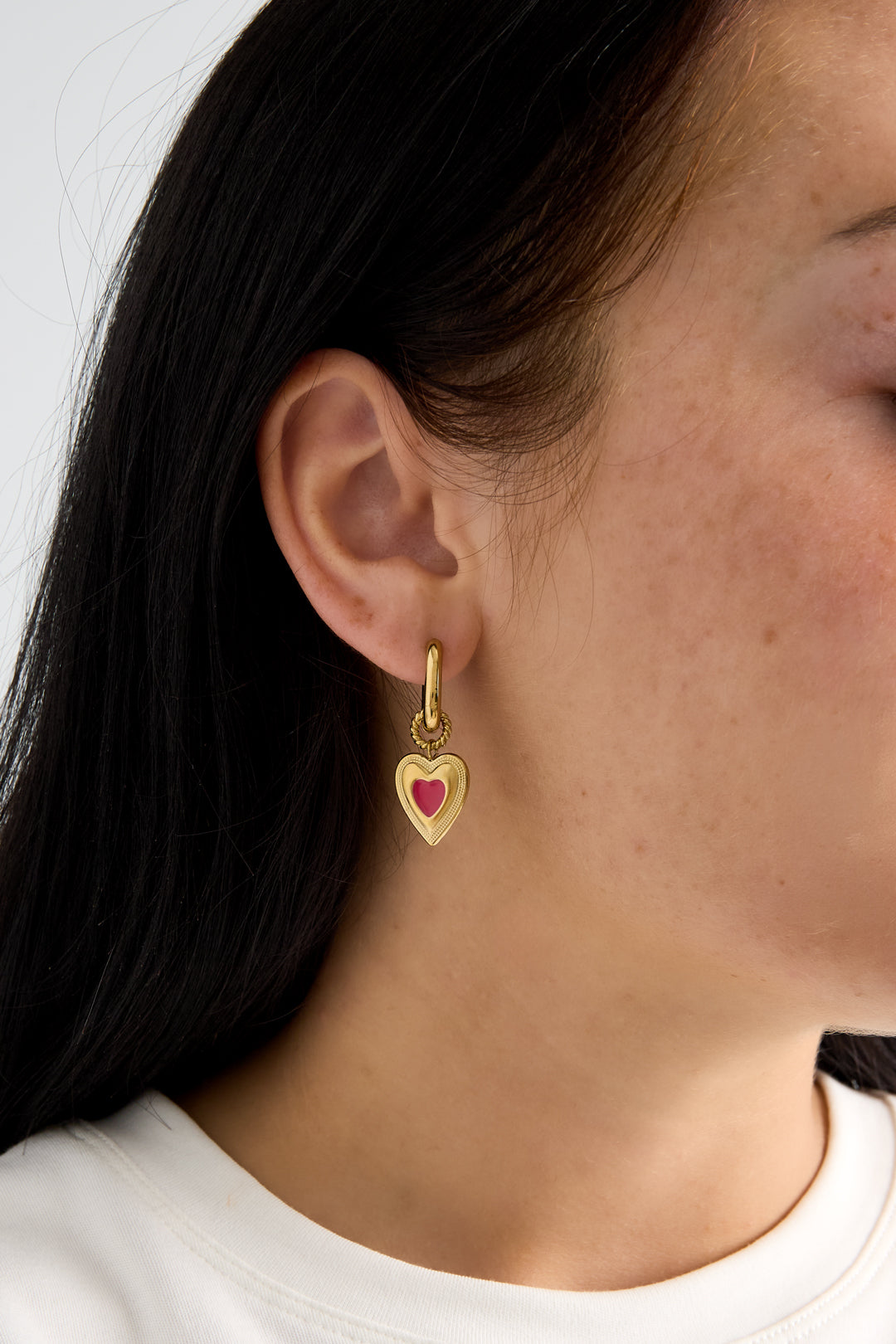 Earrings with colored heart charm
