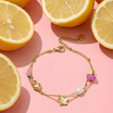 Charm bracelet with heart, flower, pearl and beads