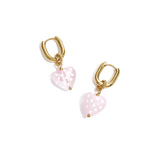 Earrings with dangling hearts with dots