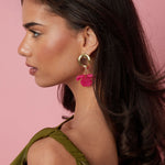 Round earrings with hanging flower