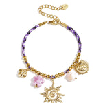 Colorful cord bracelet with varying pendants purple