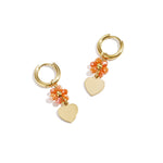 Earrings with heart on beaded flower