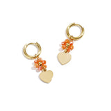 Earrings with heart on beaded flower