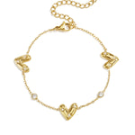 Bracelet with three set hearts and round cubic zirconia stones
