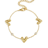 Bracelet with three set hearts and round cubic zirconia stones
