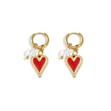 Earrings with hanging heart and pearl