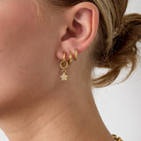 Small earring with dangling embellished star