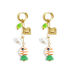 Earrings with chain and hanging charms