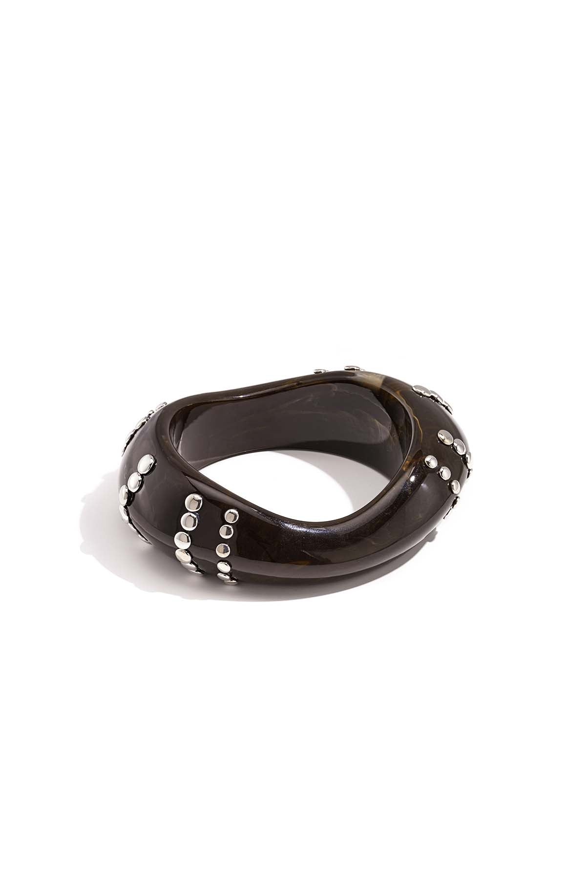 Resin bangle bracelet with studs in a striped pattern