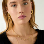 Necklace with alternating hearts and dangling stones