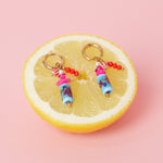 Earrings with dangling beads and a floral print