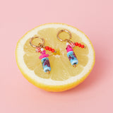 Earrings with dangling beads and a floral print