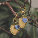 Hoop earrings with heart pendant and bead on ring