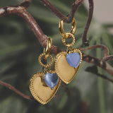 Hoop earrings with heart pendant and bead on ring