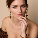 Earrings with dangling hearts on a chain