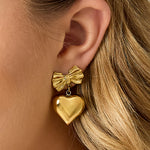 Bow earrings with hanging heart