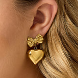 Bow earrings with hanging heart
