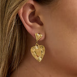 Earrings with heart-shaped pendants