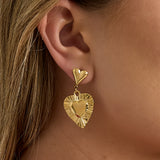 Earrings with heart-shaped pendants