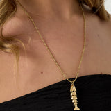 Necklace with moving fish charm