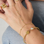 Hand chain with oval and round stones