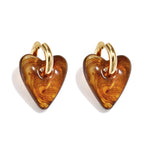 Earrings with heart-shaped resin pendant in a tortoise look