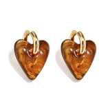 Earrings with heart-shaped resin pendant in a tortoise look