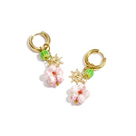 Earrings with beaded pendants and sun charm