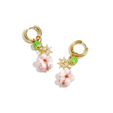 Earrings with beaded pendants and sun charm