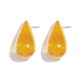 Earrings with teardrop-shaped resin studs