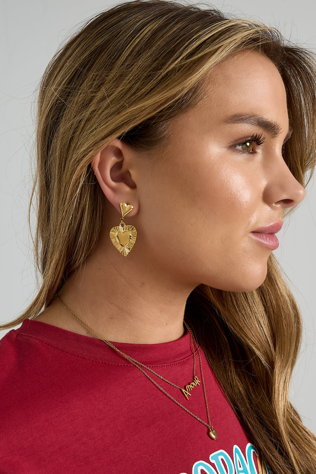 Earrings with heart-shaped pendants