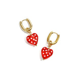 Earrings with dangling hearts with dots