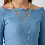 Long necklaces with a round pendant with a bumpy texture