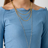 Long necklaces with a round pendant with a bumpy texture
